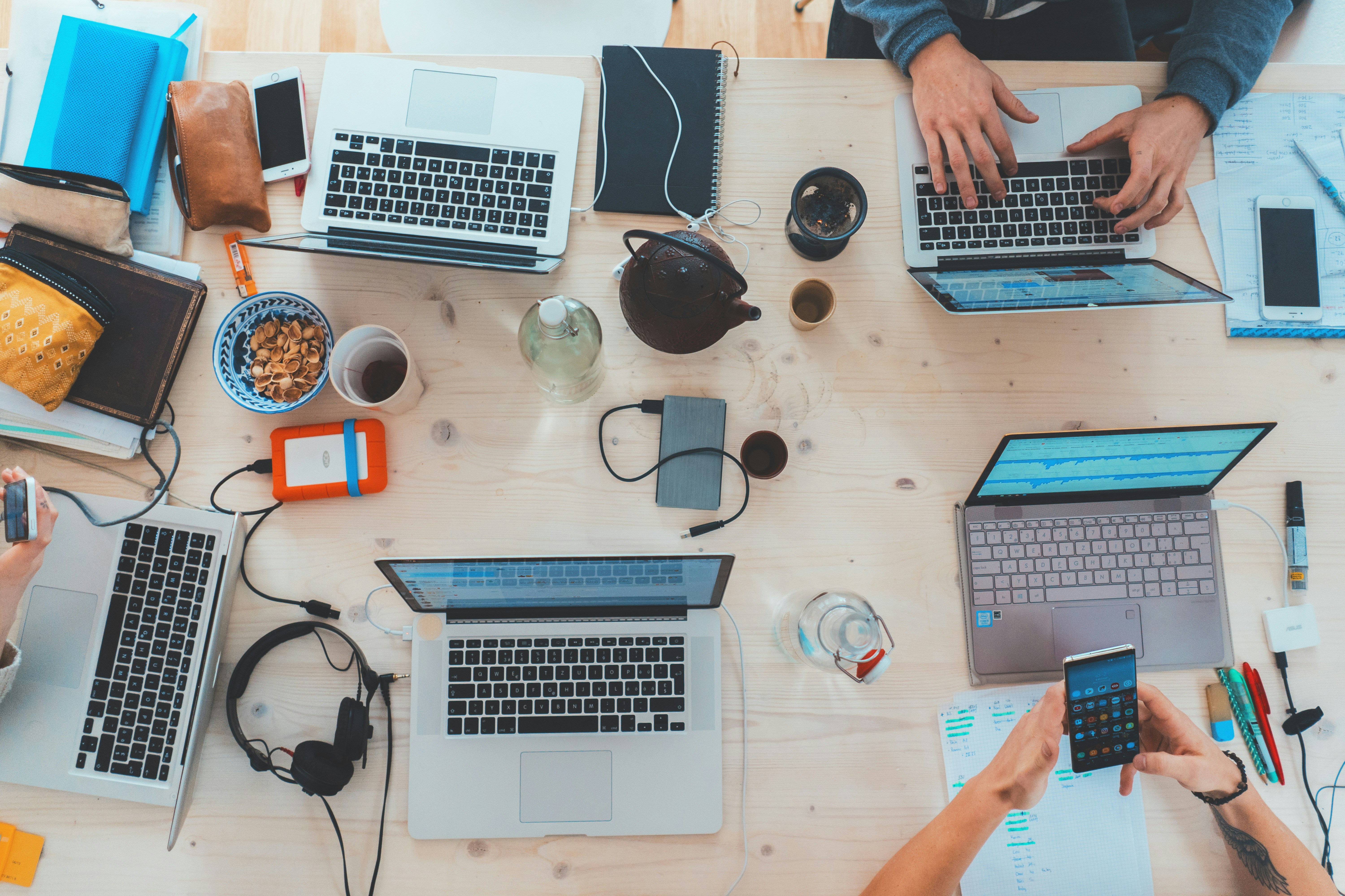 Top view of designers working on UI/UX sketches and wireframes – product design process